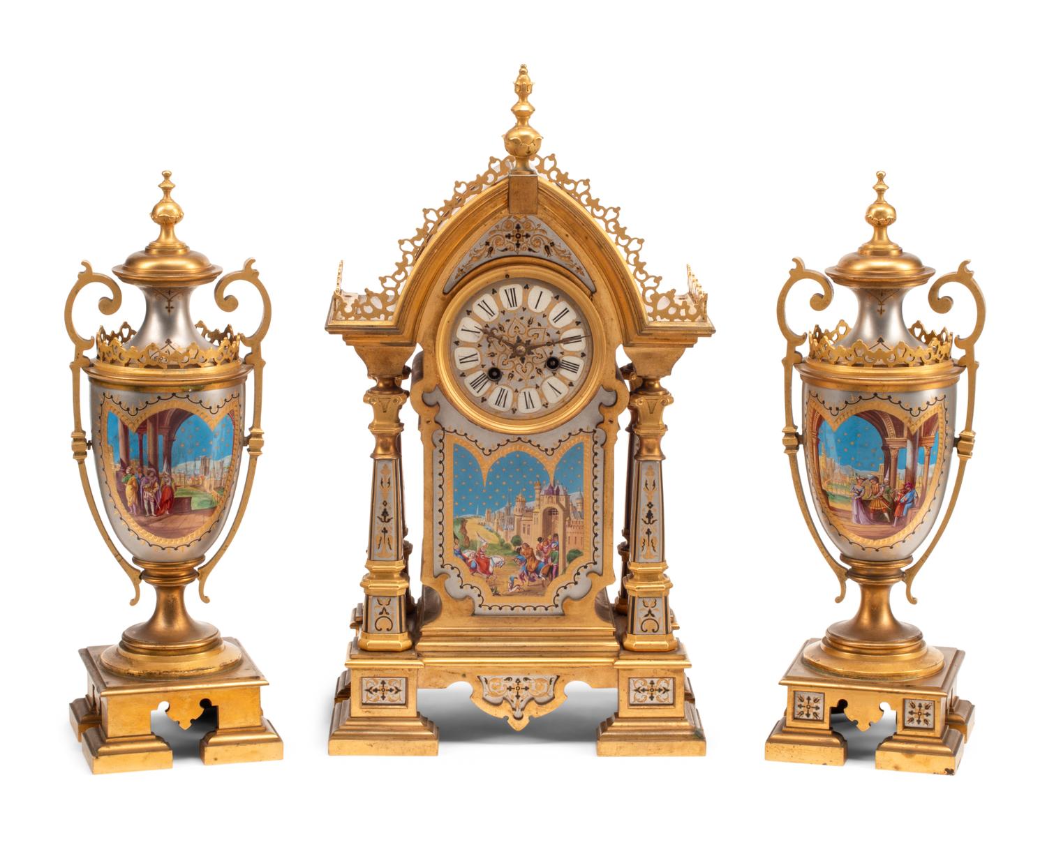 A French Gilt and Silvered Bronze and Porcelain Clock Garniture