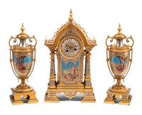 A French Gilt and Silvered Bronze and Porcelain Clock Garniture