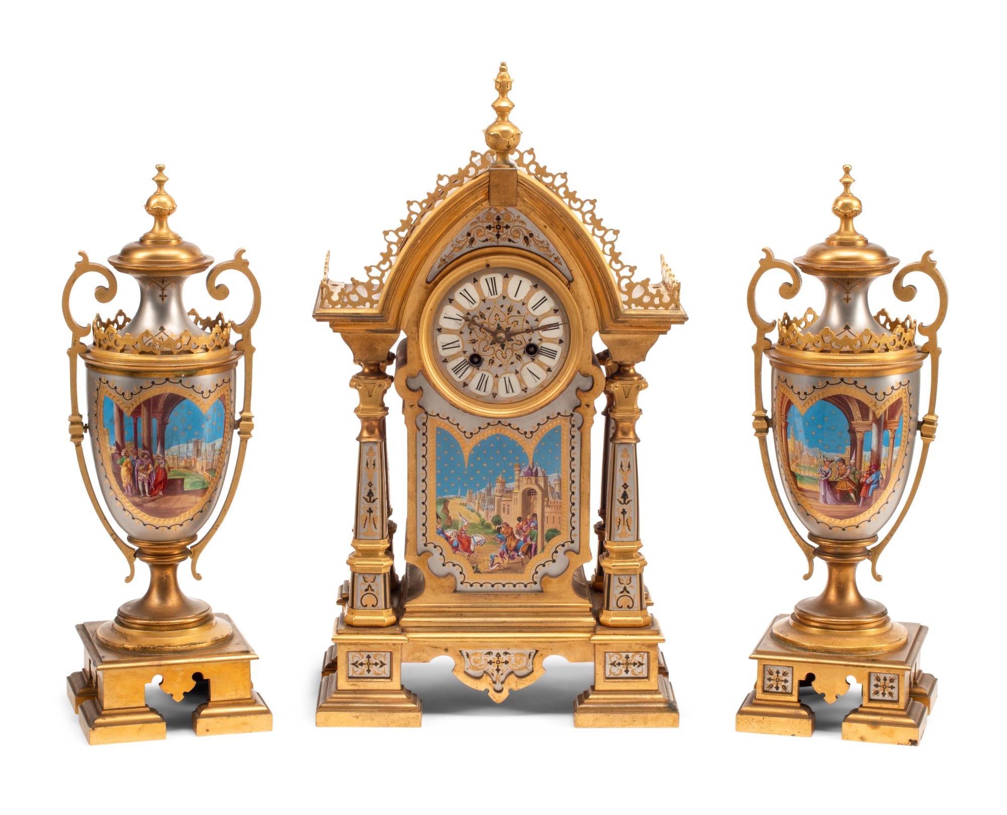 A French Gilt and Silvered Bronze and Porcelain Clock Garniture