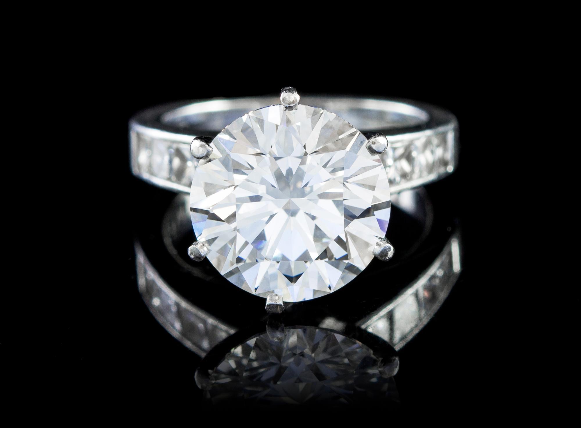 A Fine Platinum and Round Brilliant Cut Diamond Ring, 6.60 dwts.