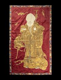 A Large Chinese Red Ground Embroidered Silk 'Longevity' Panel
