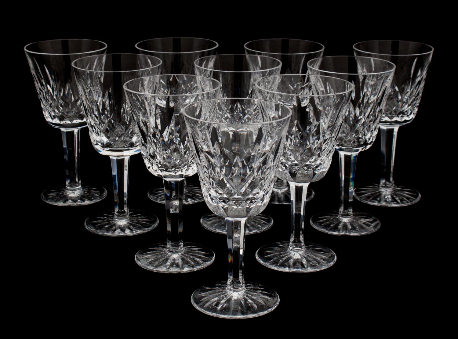 A Set of Nine Waterford Cut Crystal White Wine Glasses Height 5 3/4 inches.