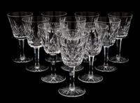 A Set of Nine Waterford Cut Crystal White Wine Glasses Height 5 3/4 inches.