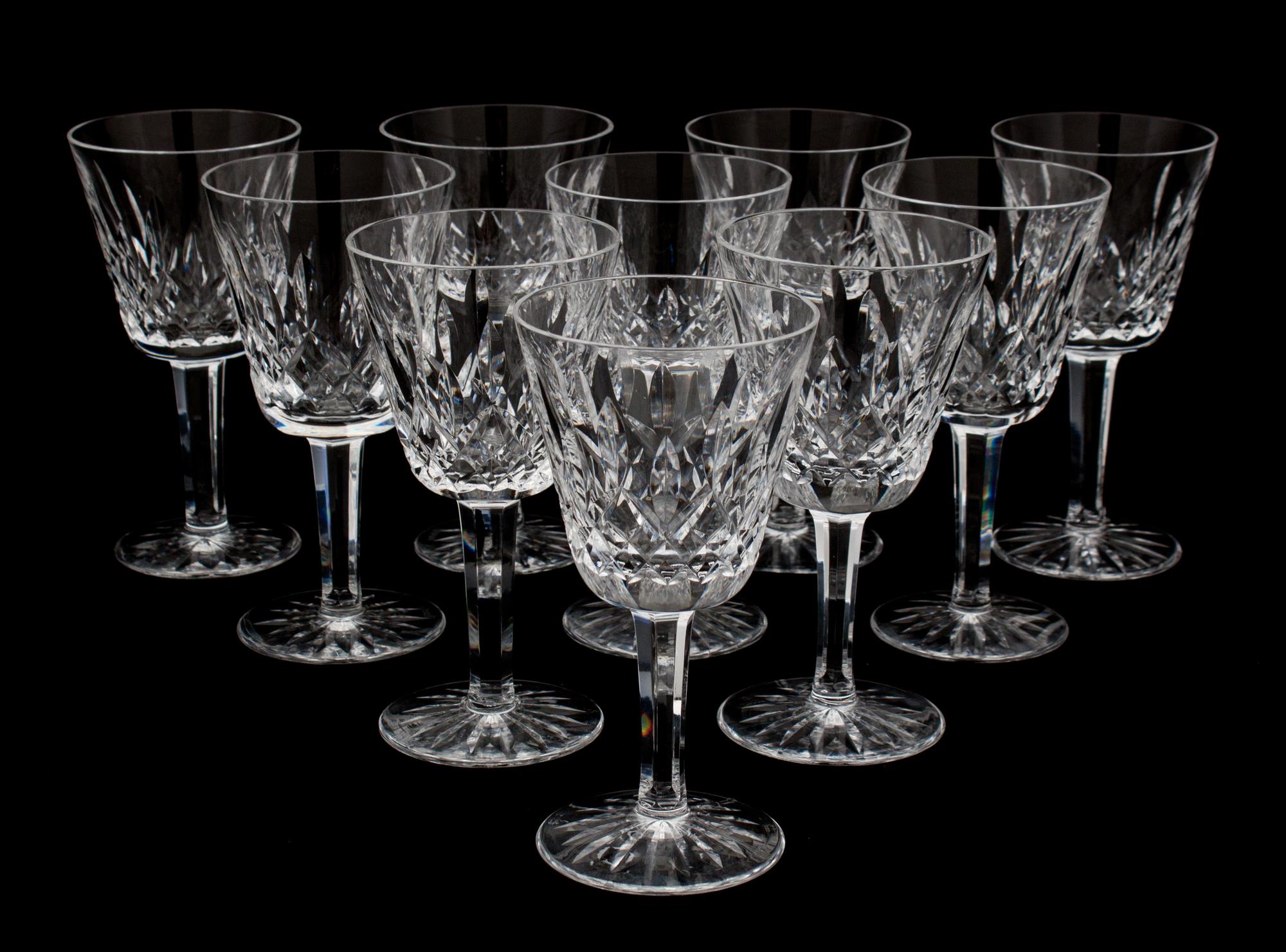 A Set of Nine Waterford Cut Crystal White Wine Glasses Height 5 3/4 inches.