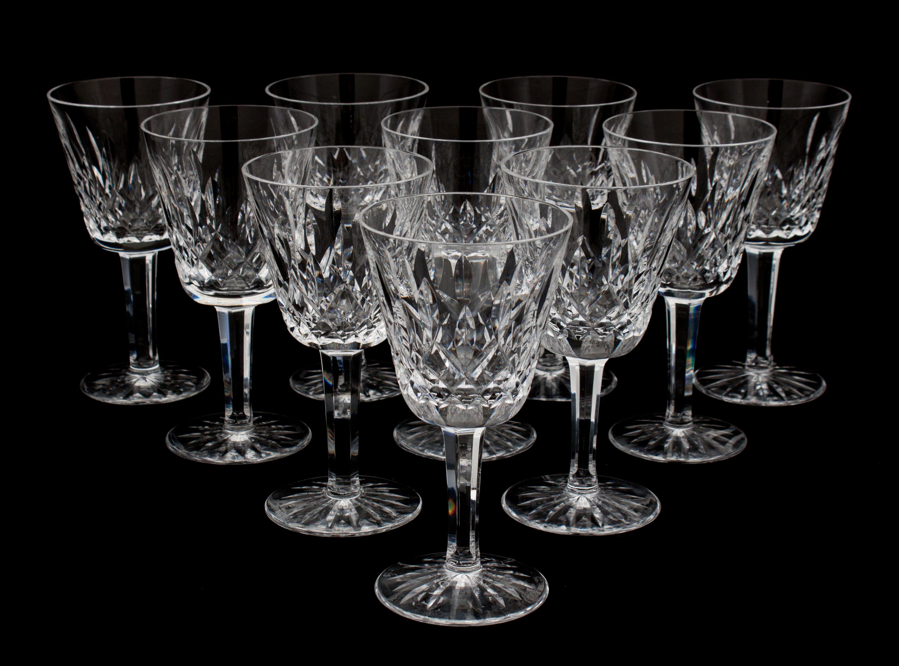 A Set of Nine Waterford Cut Crystal White Wine Glasses Height 5 3/4 inches.