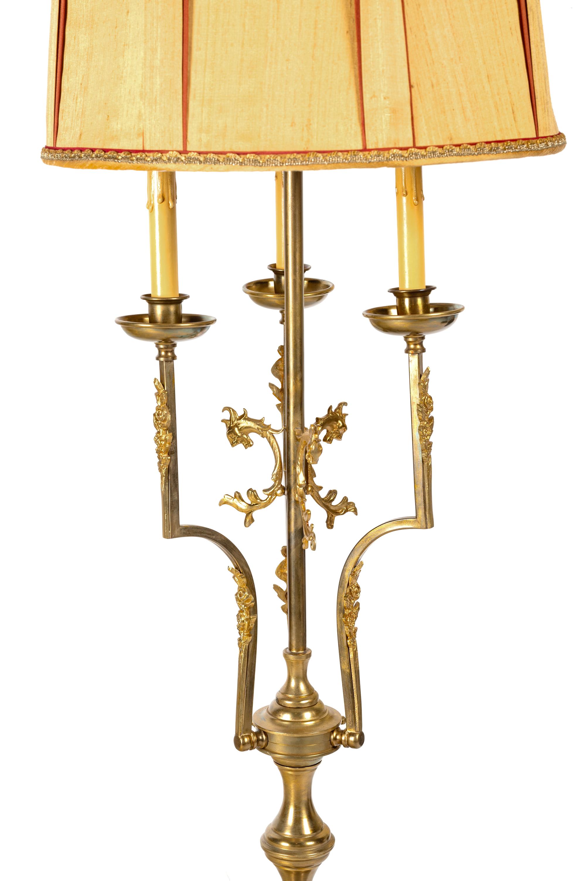An Empire Style Gilt and Patinated Metal Three-Light Floor Lamp