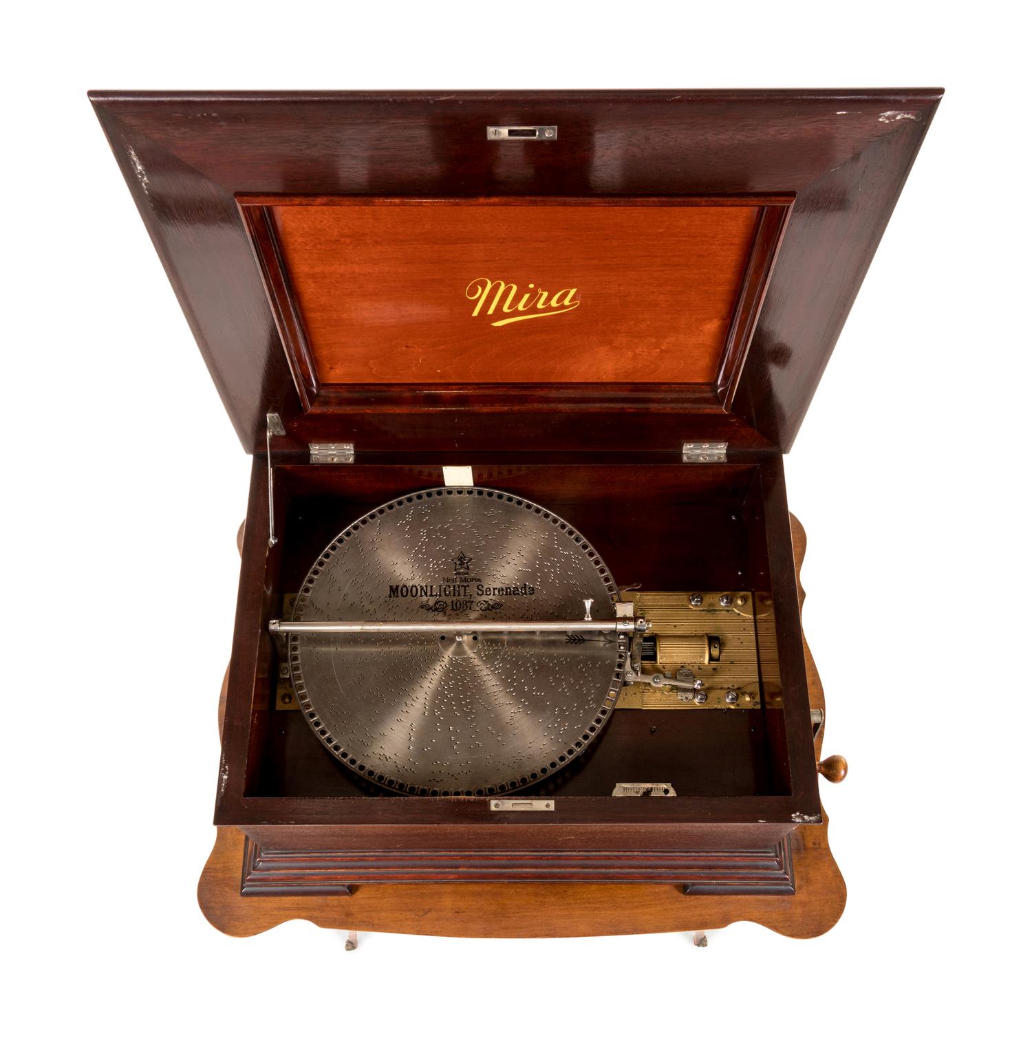 A Mira Double-Comb Disk Music Box with an Associated Table Stand and 30 Disks