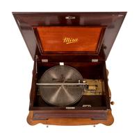 A Mira Double-Comb Disk Music Box with an Associated Table Stand and 30 Disks