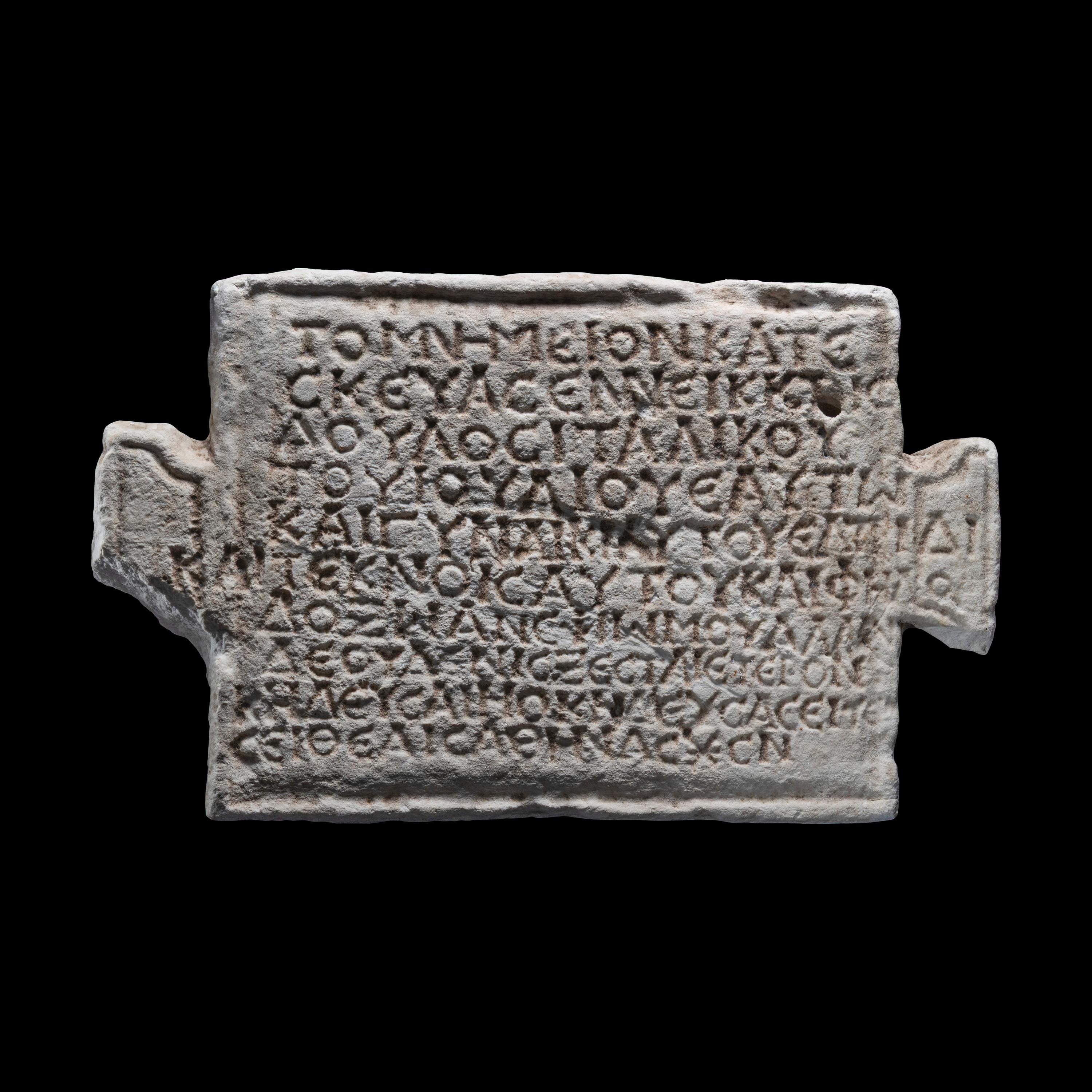 A Roman Marble Funerary Panel with Greek Inscription
