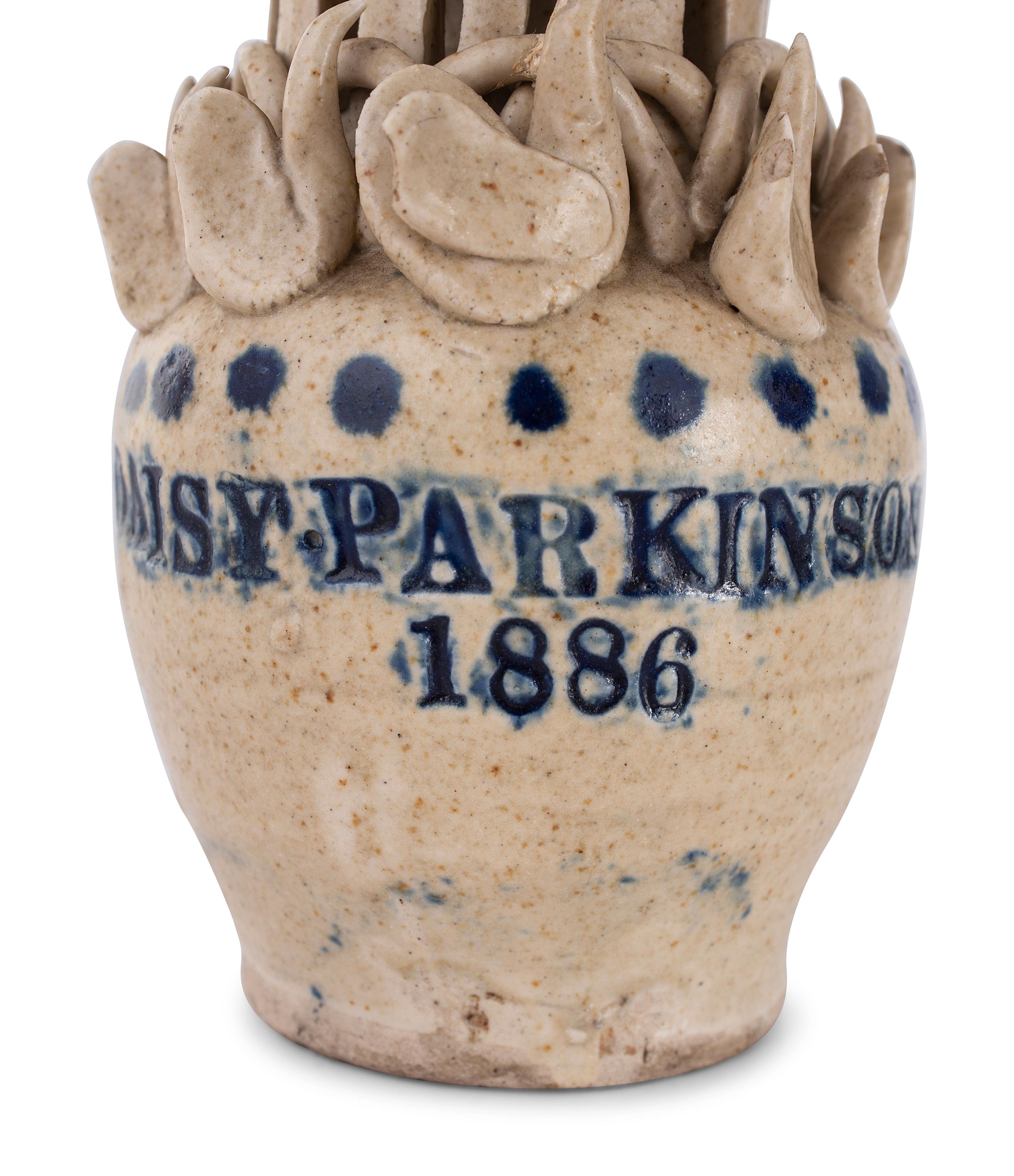 A Pair of Cobalt Decorated Stoneware Puzzle Banks