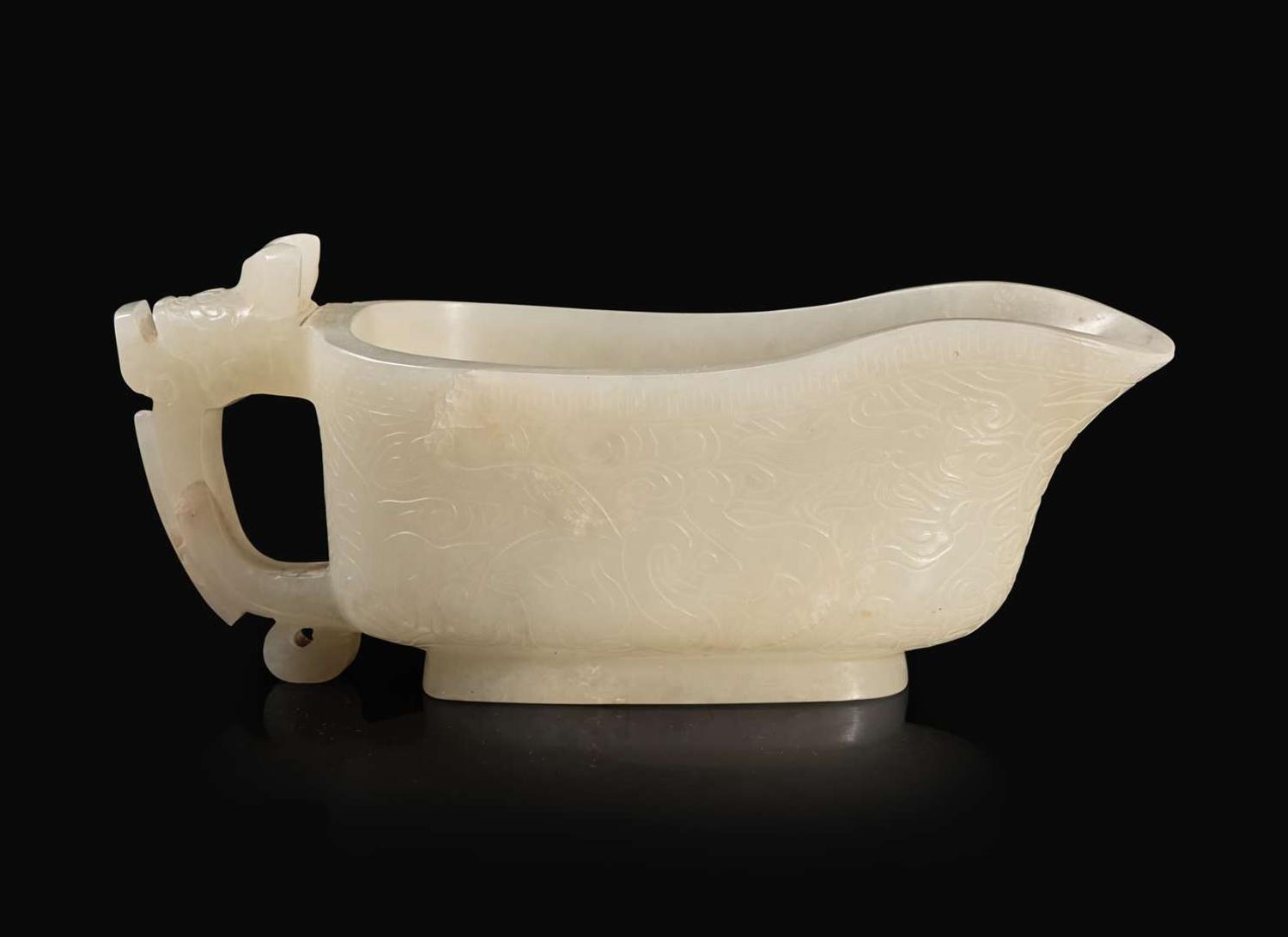 A Chinese carved white jade "Yi" water coupe, 18th/early 19th century or earlier 白玉水匜 十八至十九世紀或更早
