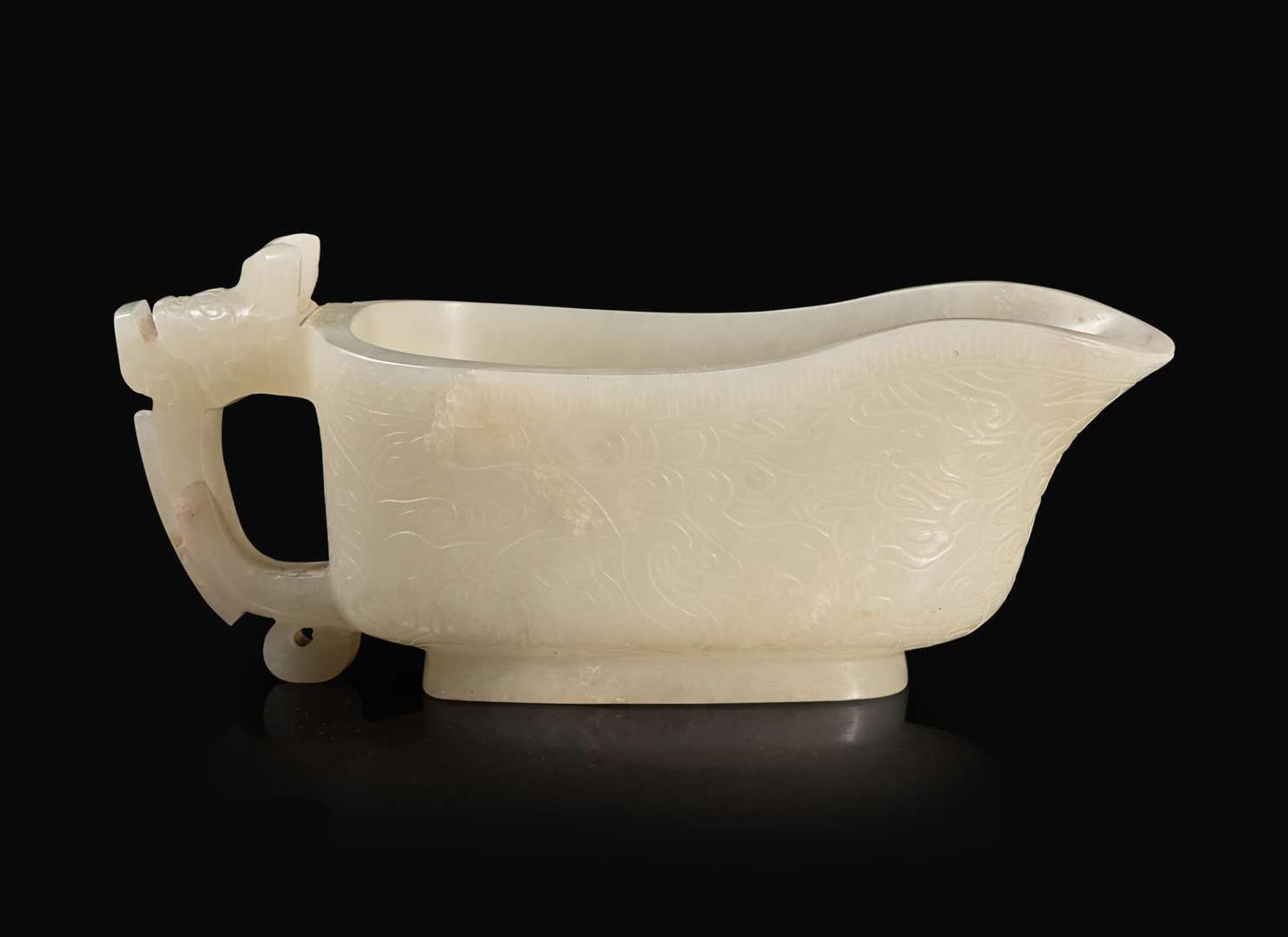A Chinese carved white jade "Yi" water coupe, 18th/early 19th century or earlier 白玉水匜 十八至十九世紀或更早