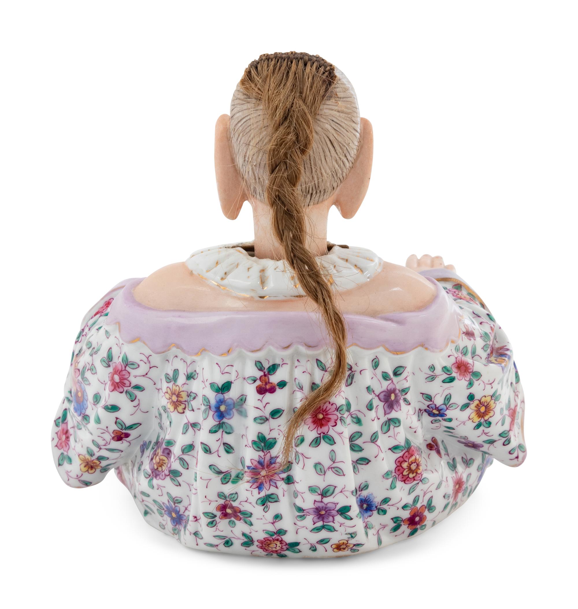 A German Porcelain "Nodder" Figure