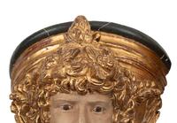 A Set of Four Italian Carved, Painted and Parcel Gilt Wall Brackets