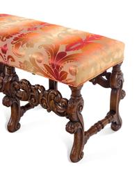 A Pair of William and Mary Style Carved Walnut Benches