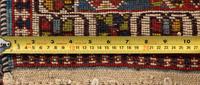A Group of Three Wool Rugs