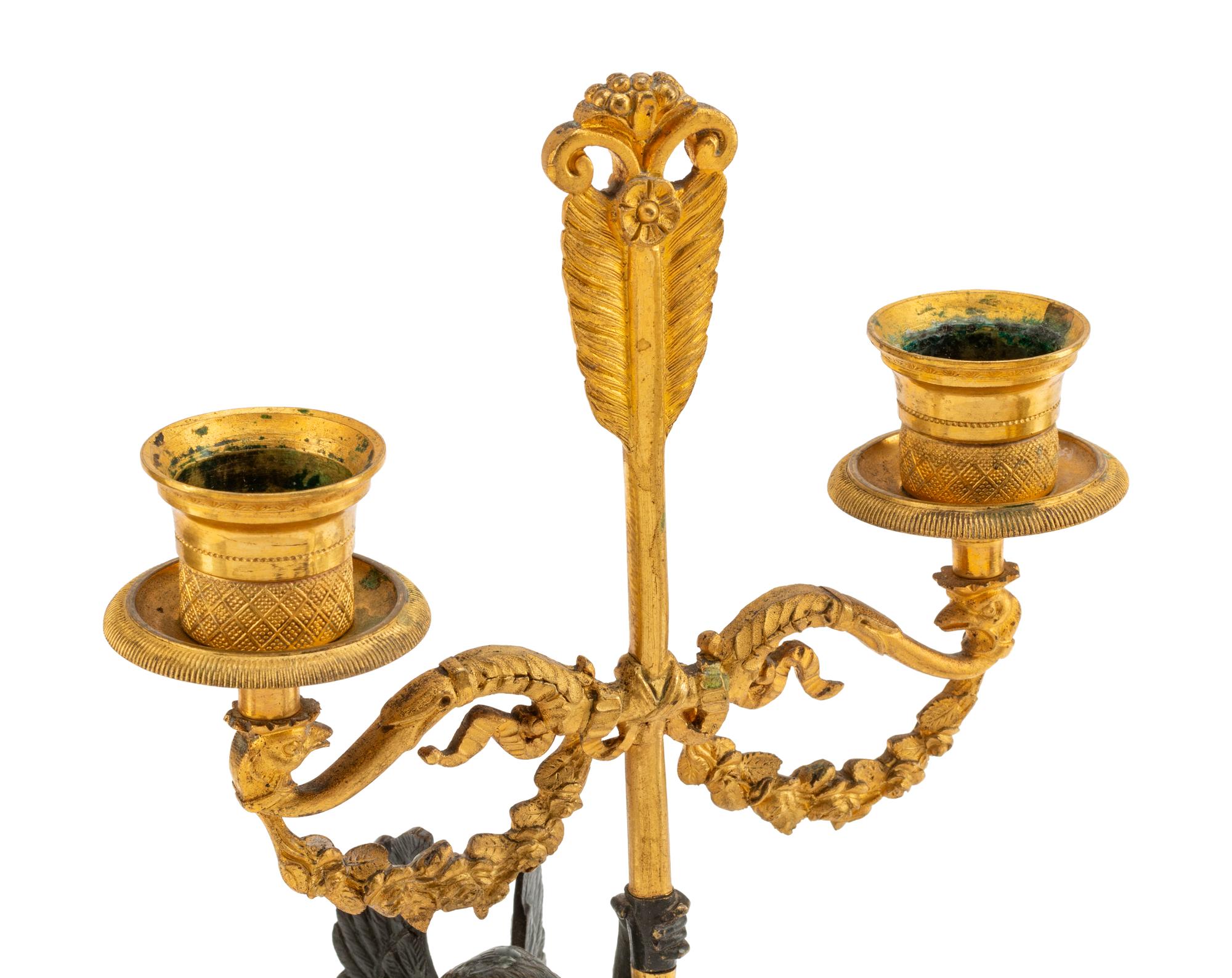 A Pair of Empire Style Gilt and Patinated Bronze Figural Two-Light Candelabra