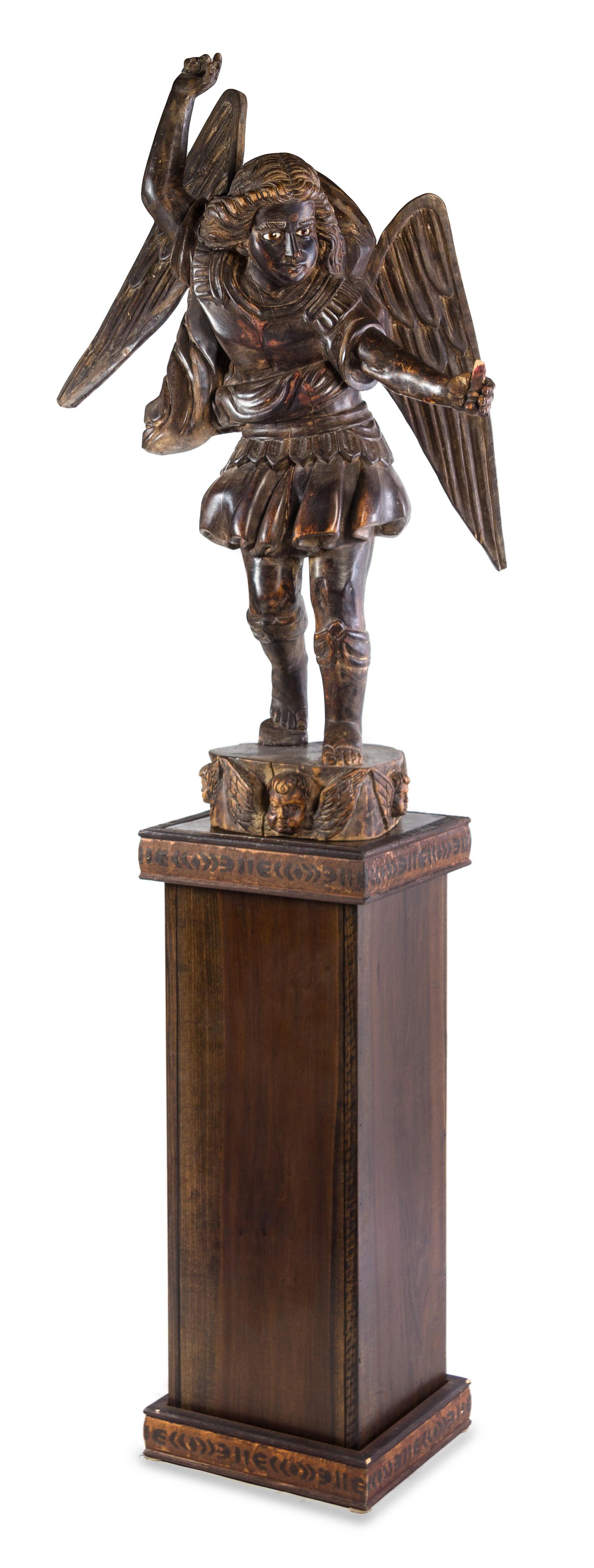 A Continental Carved Wood Figure of Saint Michael Height of figure 51 1/2 inches; height overall 95 3/8 inches. — 20TH CENTURY