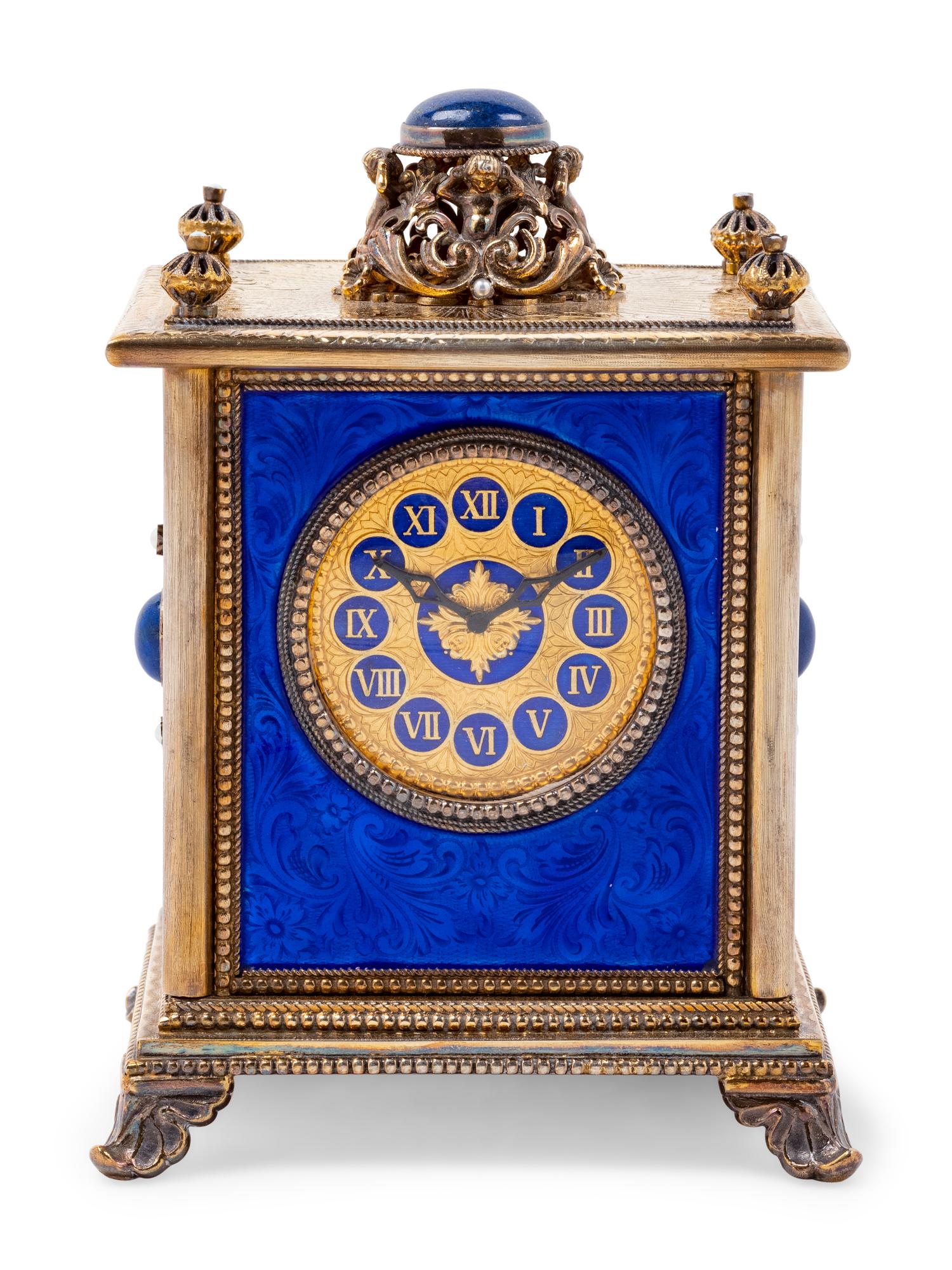 A Continental Blue Hardstone and Cultured Pearl Inset Gilt Metal and Enameled Table Clock