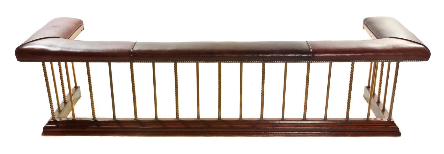 A Brass and Leather Upholstered Club Fire Fender, Width 89 inches.