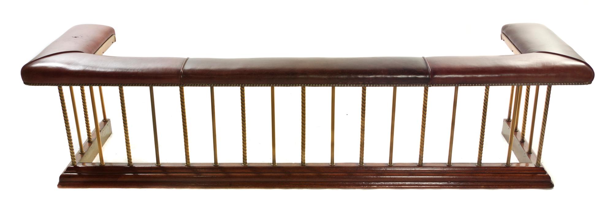 A Brass and Leather Upholstered Club Fire Fender, Width 89 inches.