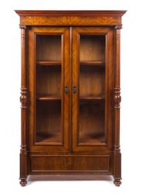 A German Neoclassical Walnut Bookcase Height 73 1/2 x width 46 1/4 x depth 22 1/4 inches. — LATE 19TH CENTURY