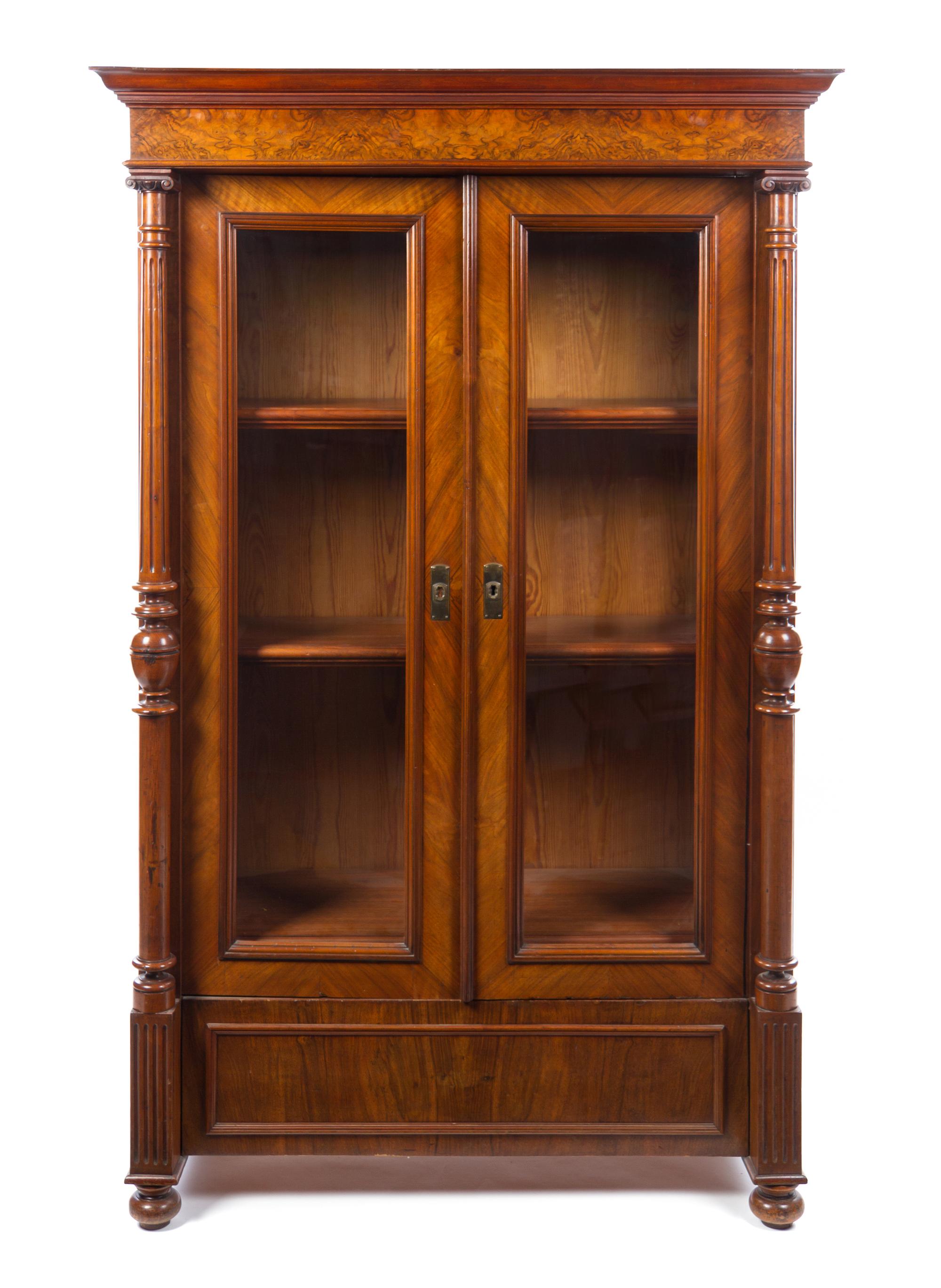 A German Neoclassical Walnut Bookcase Height 73 1/2 x width 46 1/4 x depth 22 1/4 inches. — LATE 19TH CENTURY