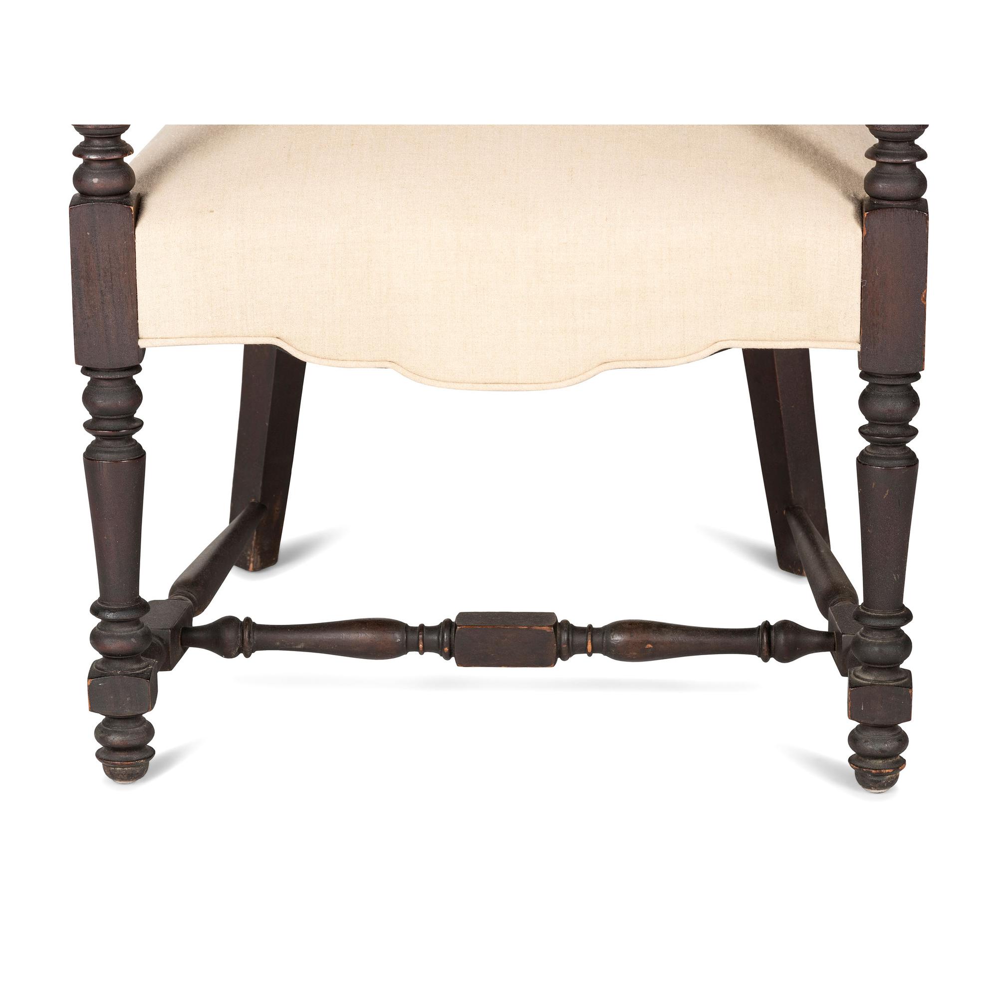 A William IV Carved and Turned Walnut Stretcher Base Library Armchair