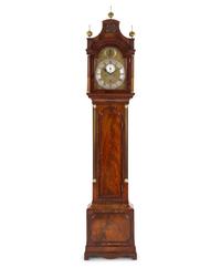 A George III Brass Mounted and Figured Mahogany Tall Case Clock