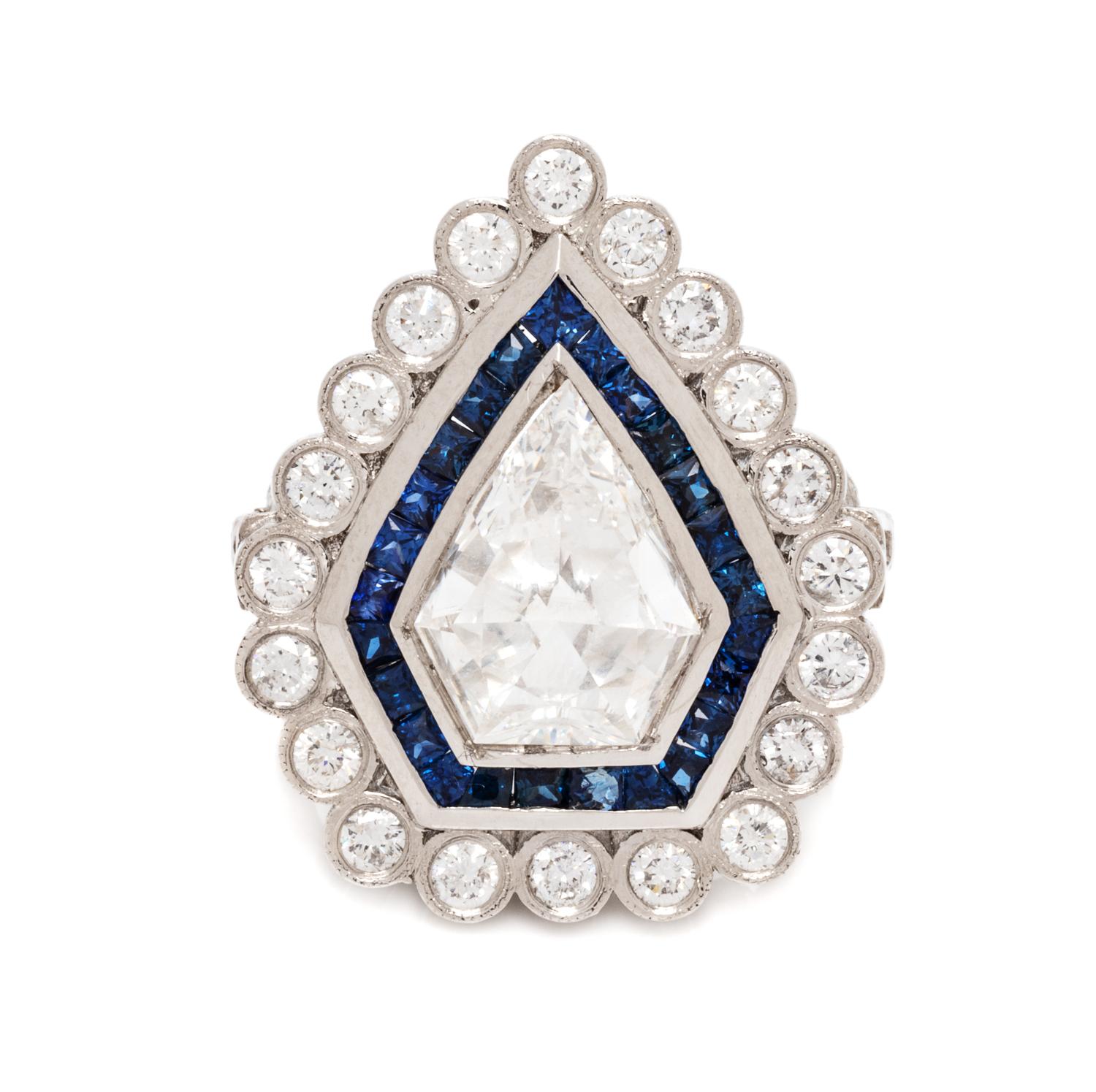 A Platinum, Diamond and Sapphire Ring, 15.40 dwts.