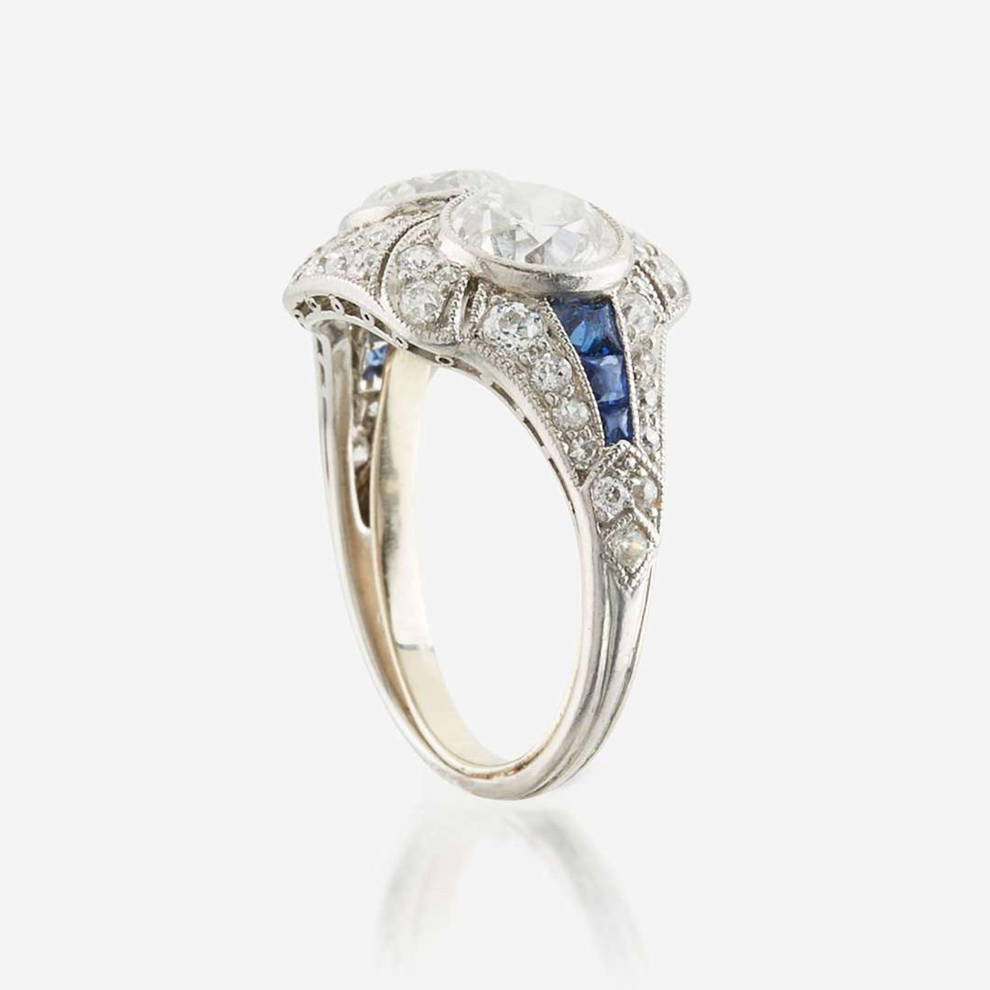 A diamond, sapphire, and platinum ring, J. E. Caldwell & Co.