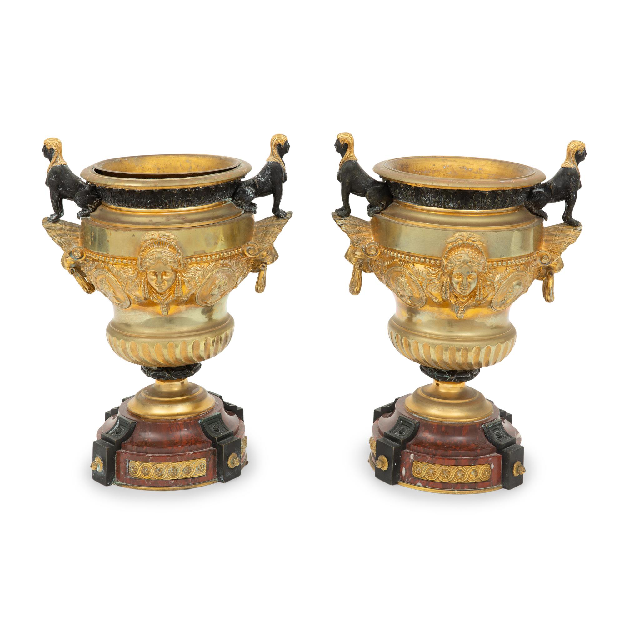 A Pair of French Egyptian Revival Gilt Bronze and Marble Urns