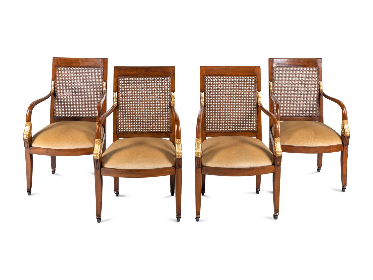 A Set of Four Baltic Style Parcel Gilt Walnut Armchairs