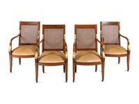 A Set of Four Baltic Style Parcel Gilt Walnut Armchairs