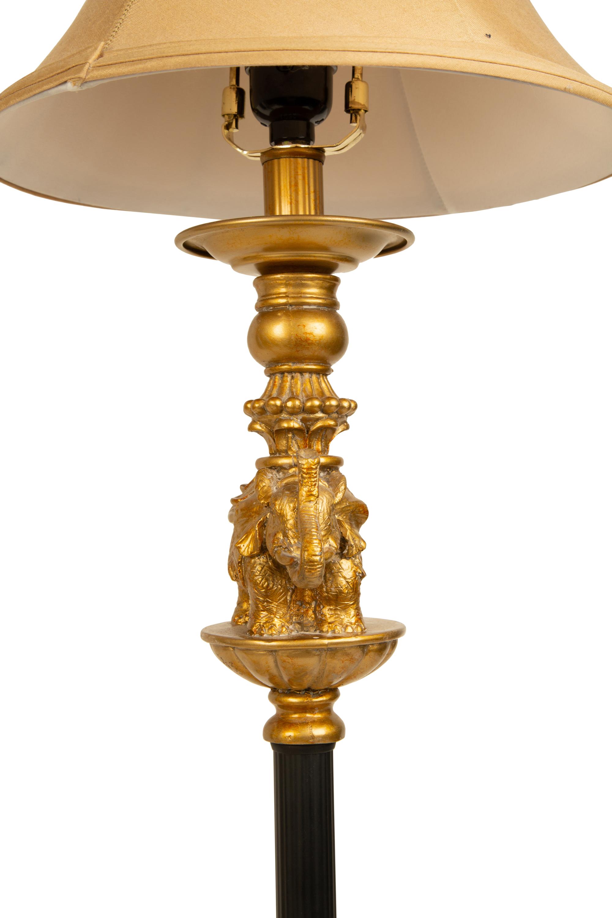 A Pair of Empire Style Ebonized and Gilt Metal Elephant Candlesticks now Mounted as Lamps — 20TH CENTURY
