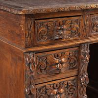 A Renaissance Revival Carved Oak Pedestal Desk