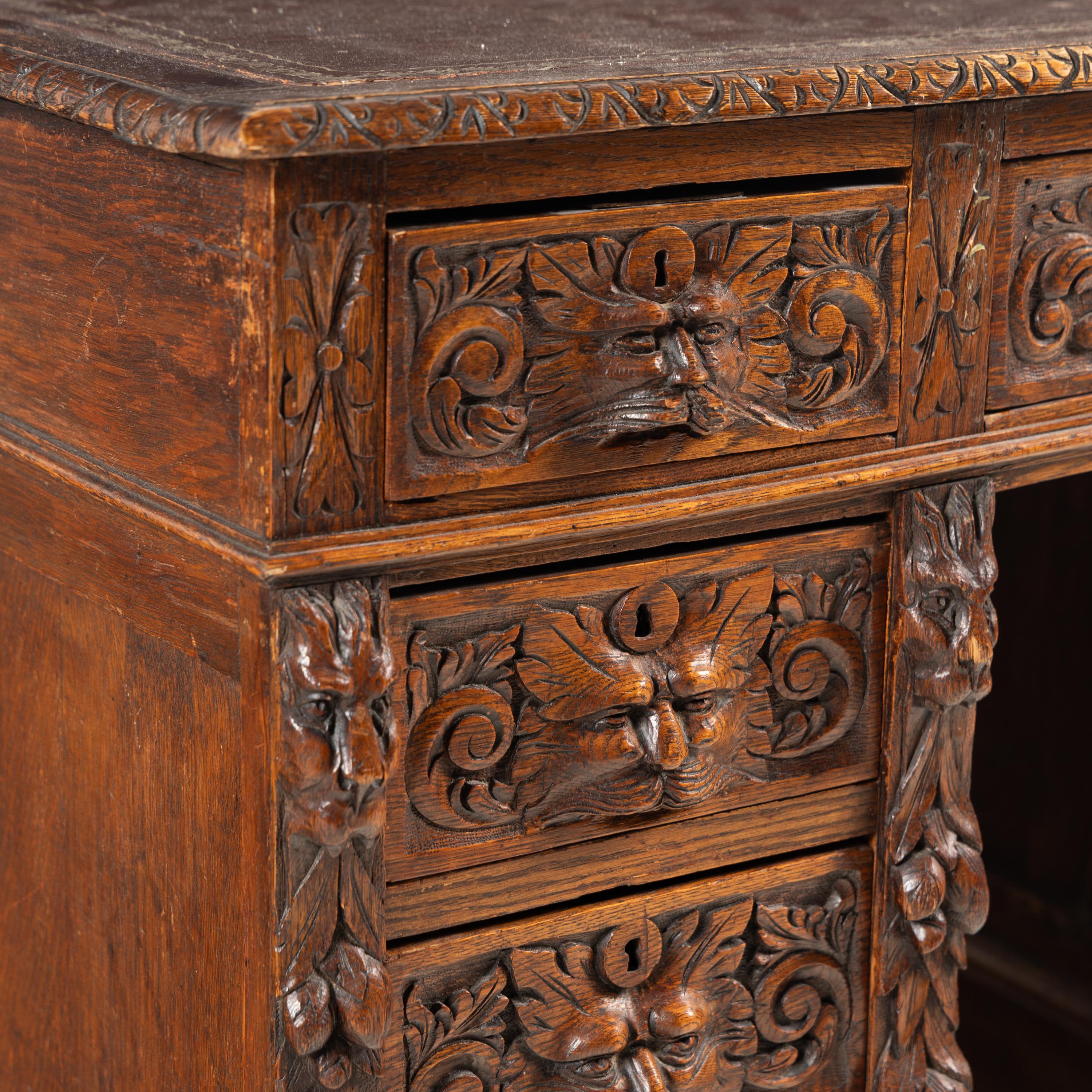 A Renaissance Revival Carved Oak Pedestal Desk