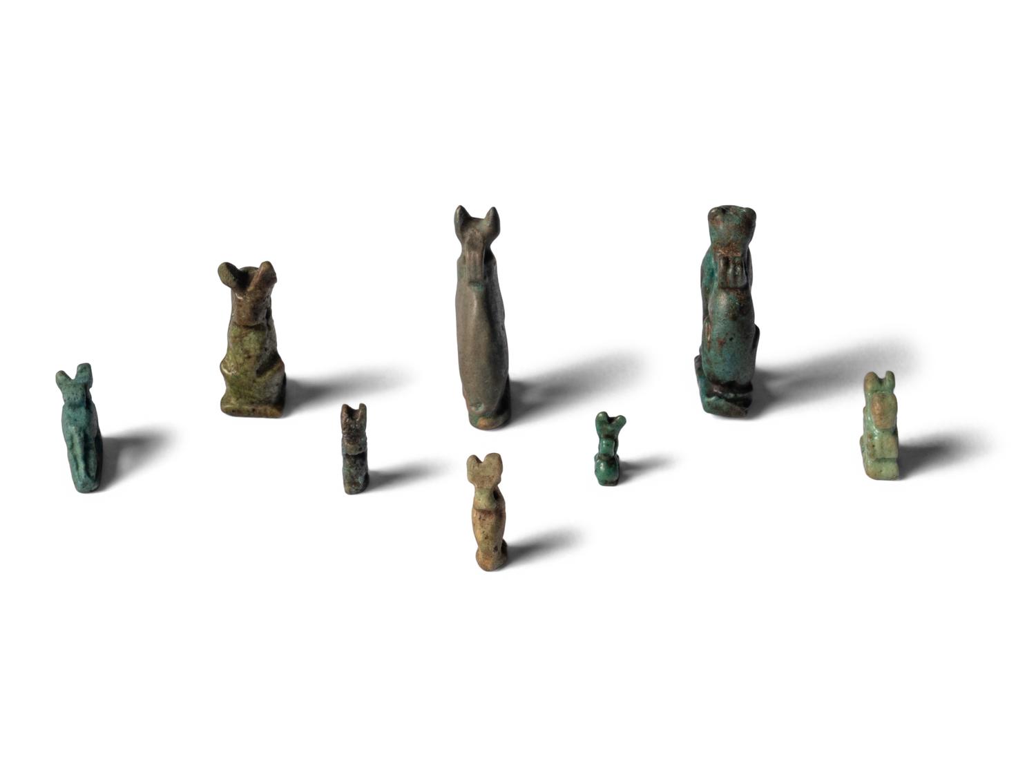 Eight Egyptian Faience Bastet Amulets