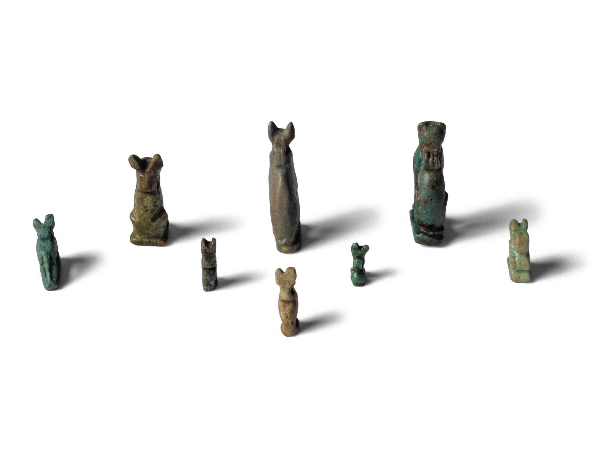 Eight Egyptian Faience Bastet Amulets
