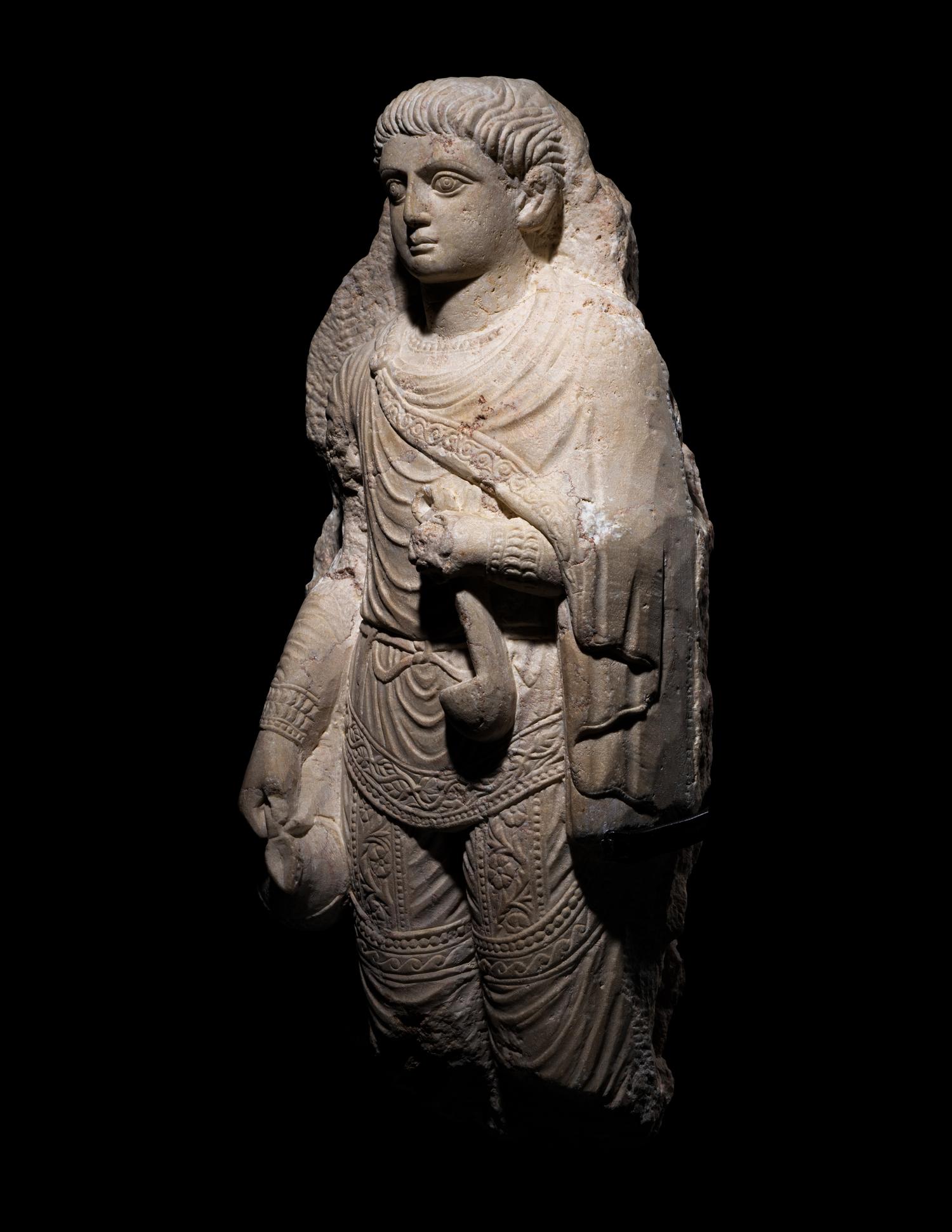A Palmyrene Limestone Relief Fragment of a Youth