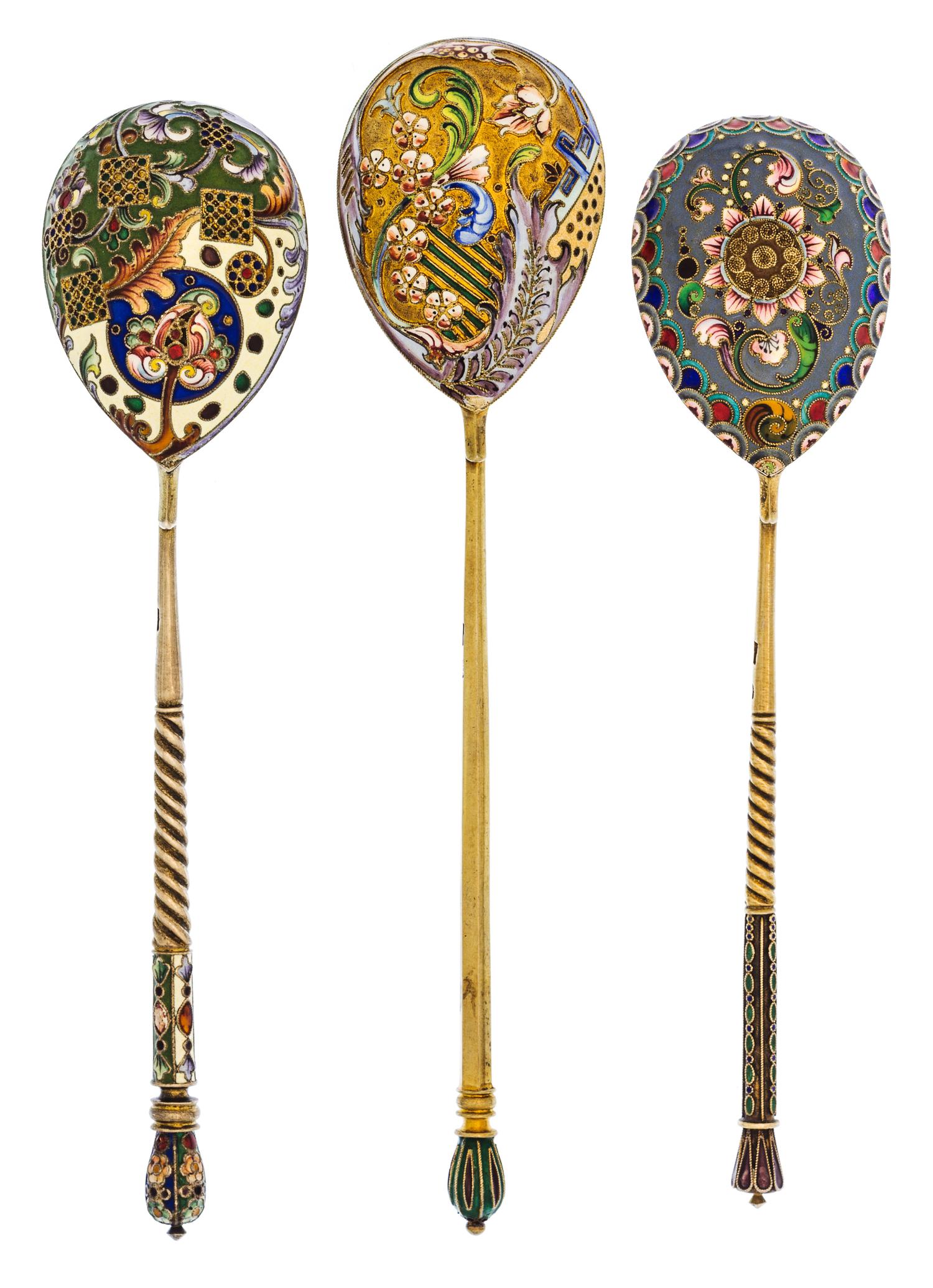 A Group of Three Russian Silver-Gilt and Enamel Spoons, Mark of 11th Artel, Moscow, early 20th century, each having an enameled finial,