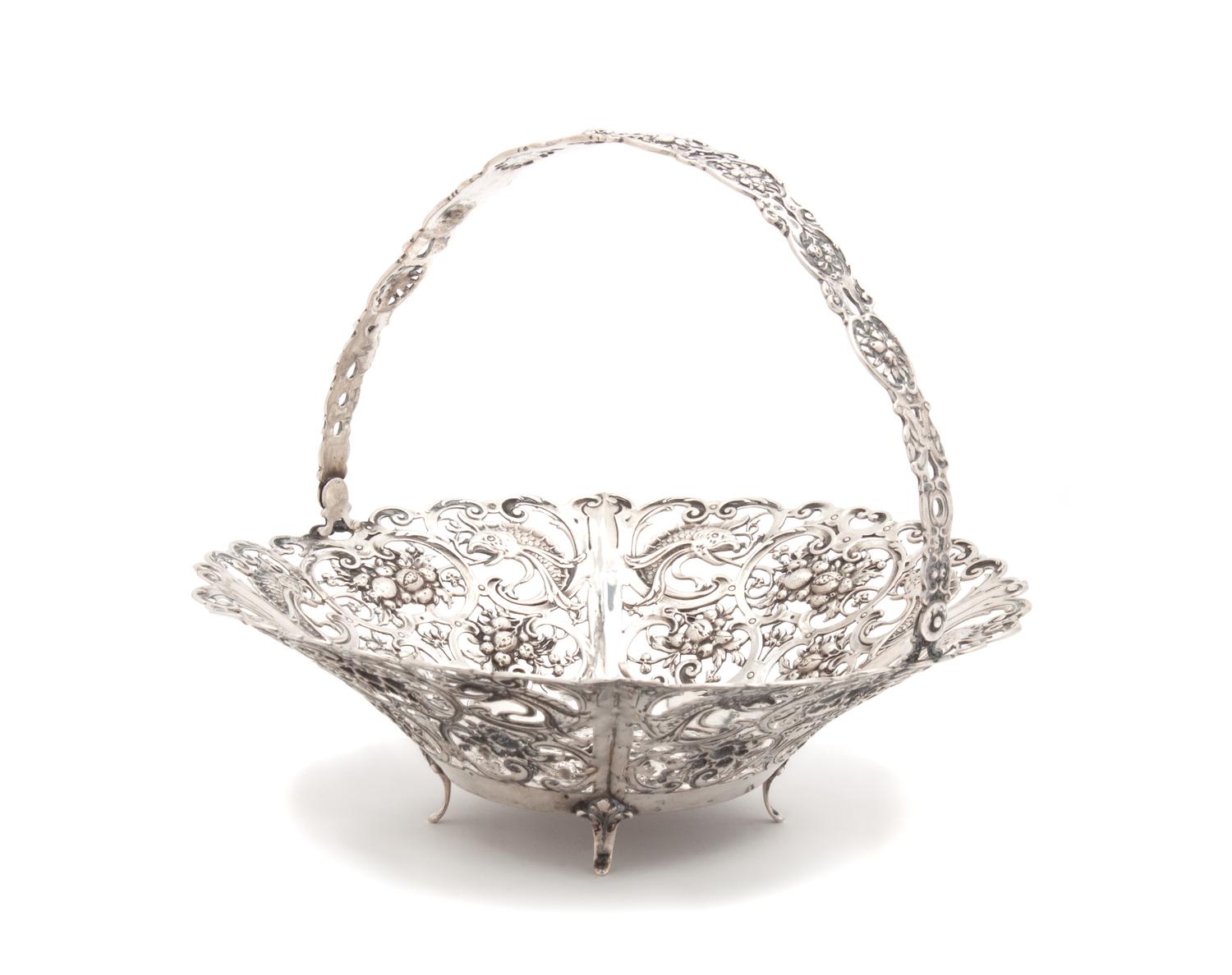 A German Silver Reticulated Basket with Swing Handle Diameter 9 1/2 inches. — 20TH CENTURY