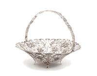 A German Silver Reticulated Basket with Swing Handle Diameter 9 1/2 inches. — 20TH CENTURY