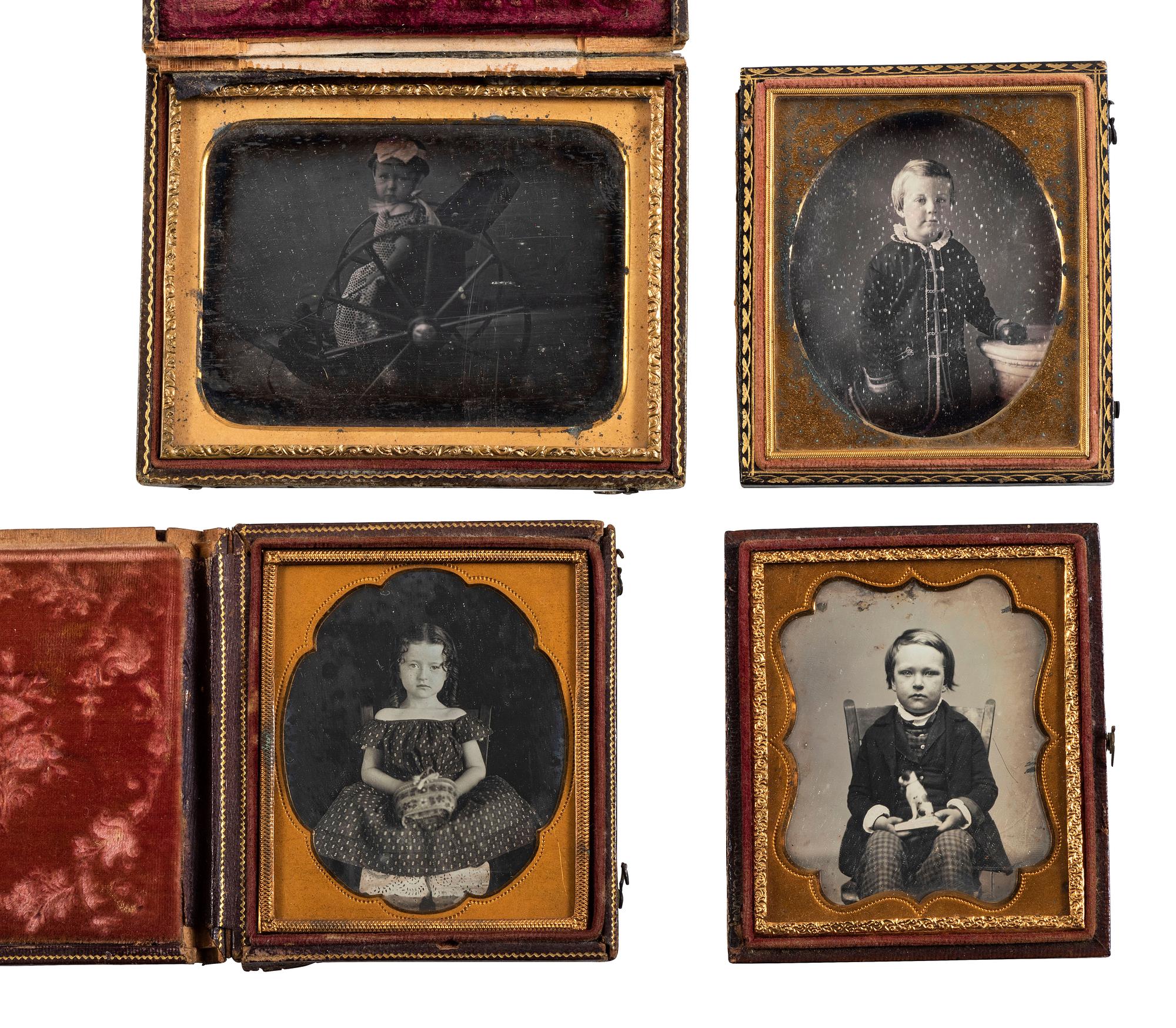 [EARLY PHOTOGRAPHY]. 4 daguerreotype portraits of children posed with interesting props, including: