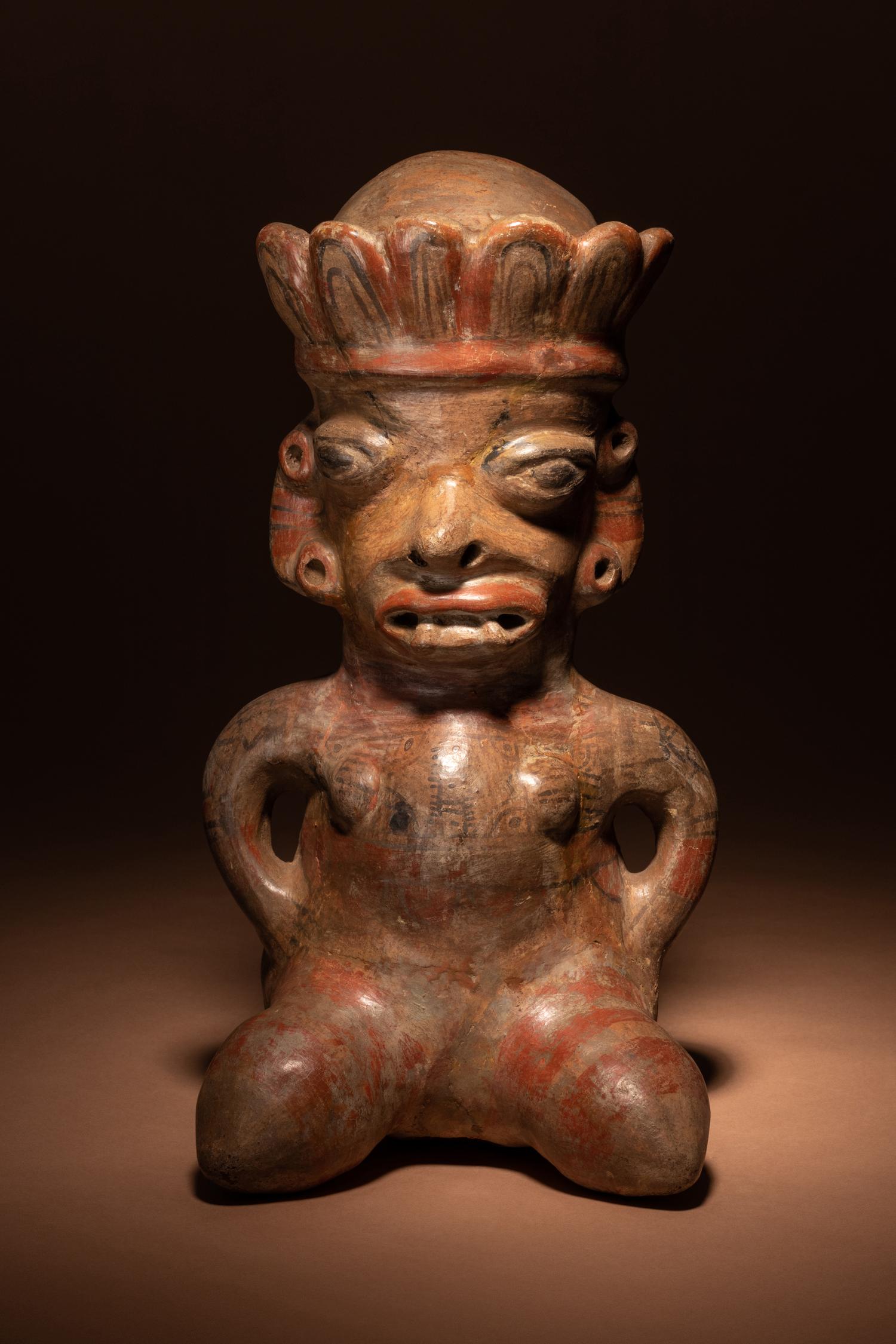 A Nicoya Polychrome Terracotta Seated Figure