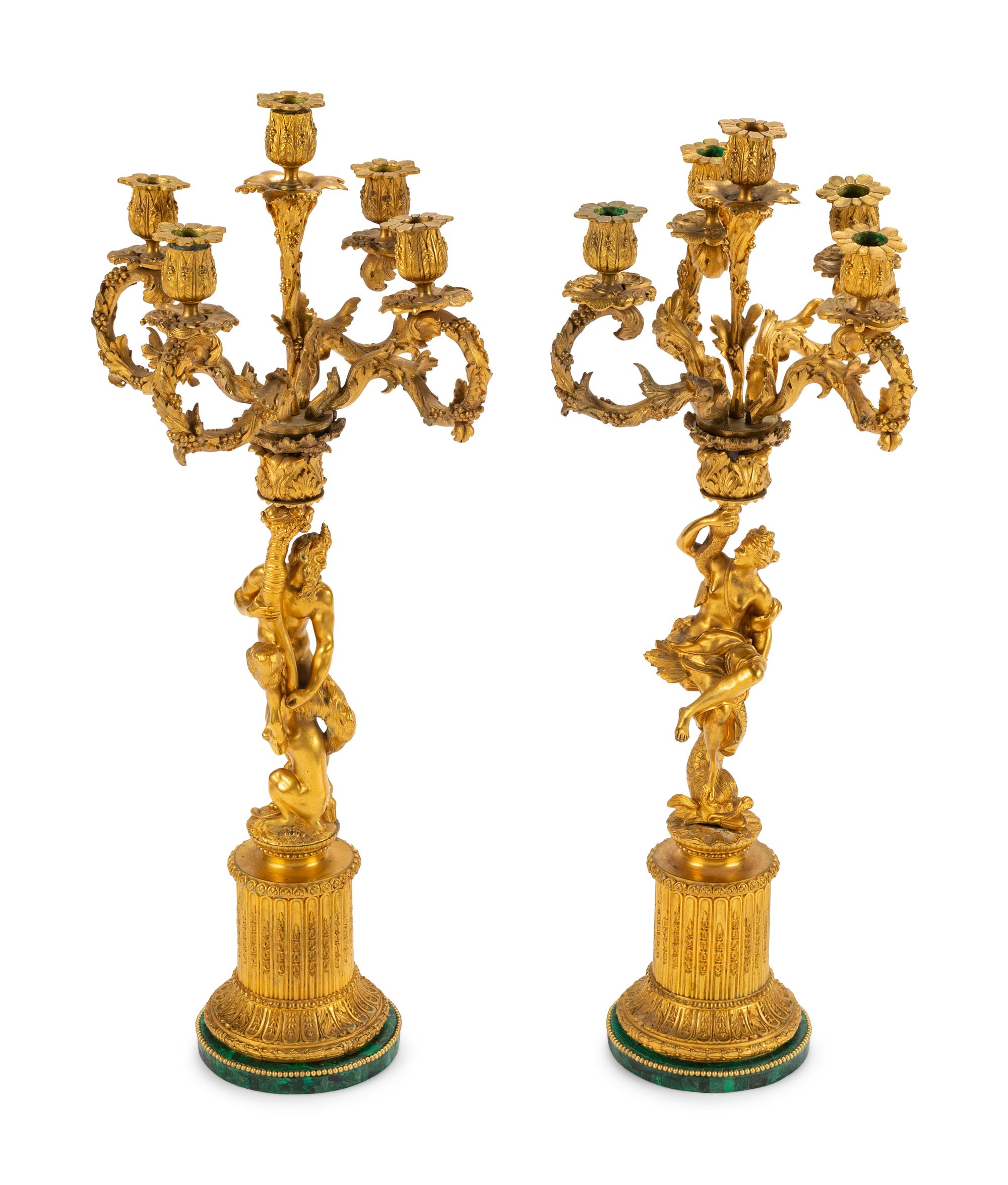 A Pair of Continental Gilt Bronze Figural Five-Light Candelabra with Malachite Veneered Bases