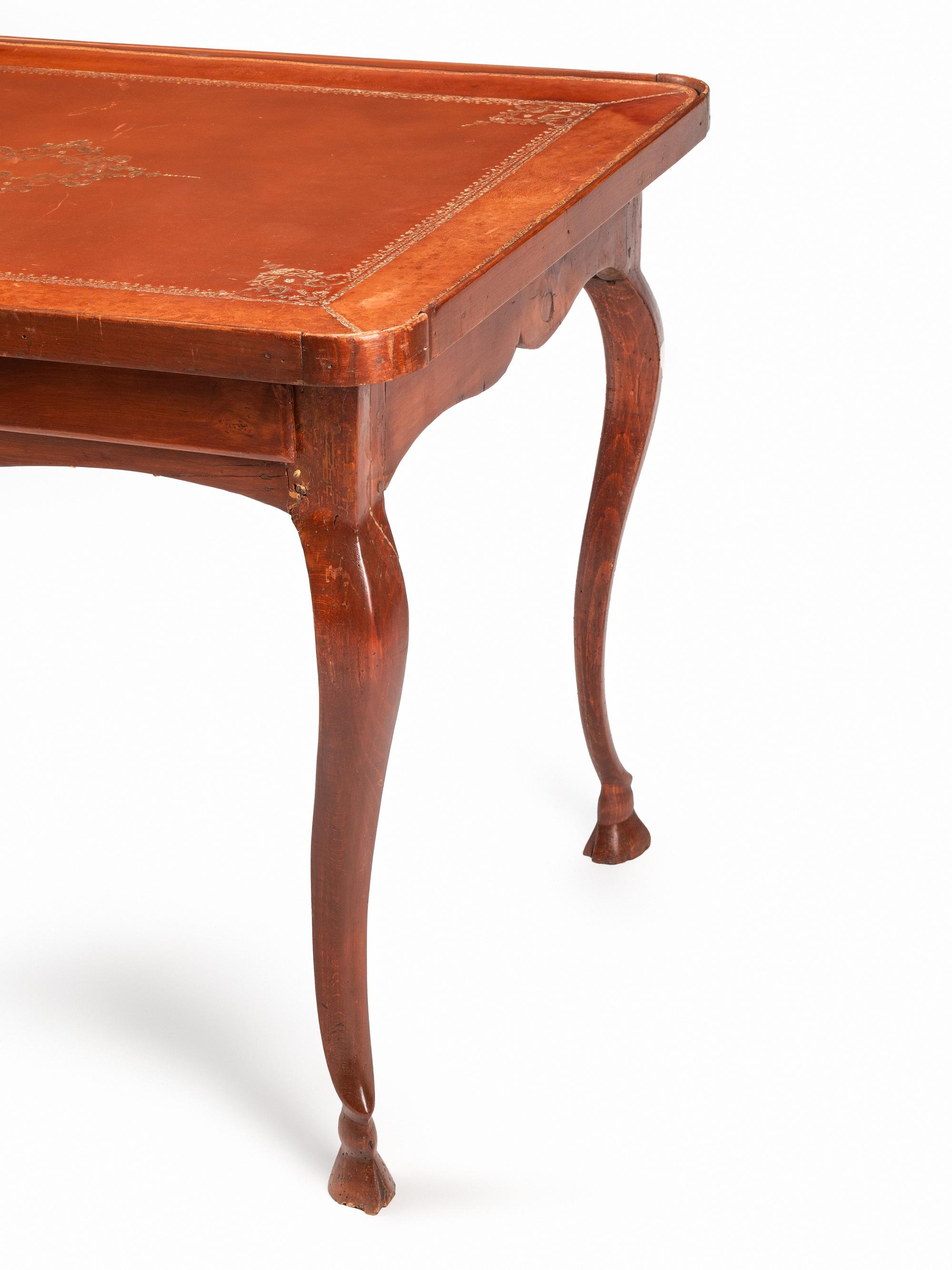 A French Provincial Fruitwood and Tooled Leather Writing Table