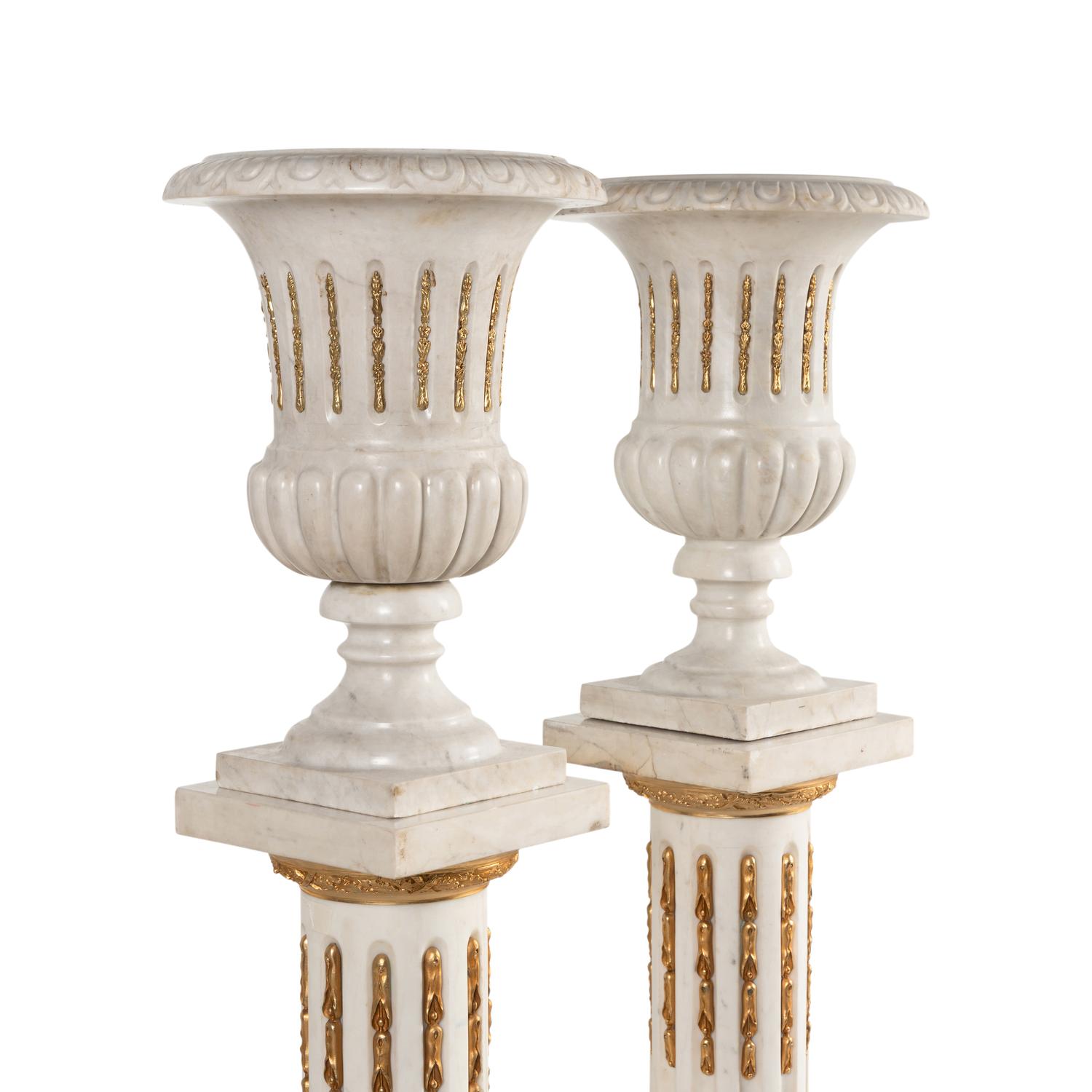 A Pair of Neoclassical Style Gilt Bronze Mounted Marble Urns on Pedestals