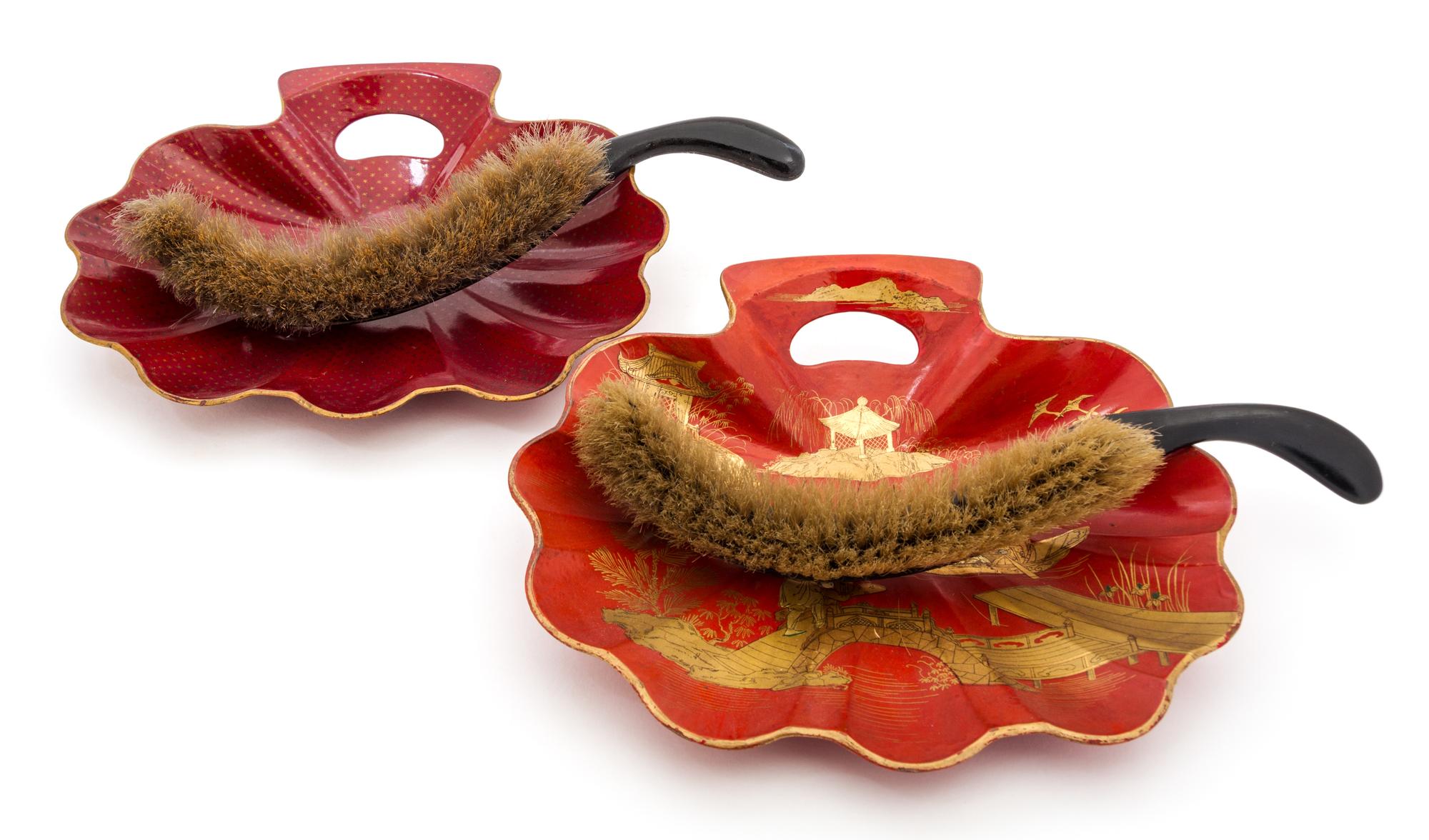 Two Japanese Gilt Decorated Red Lacquer Crumber Sets Length of brush 13 1/2 inches.