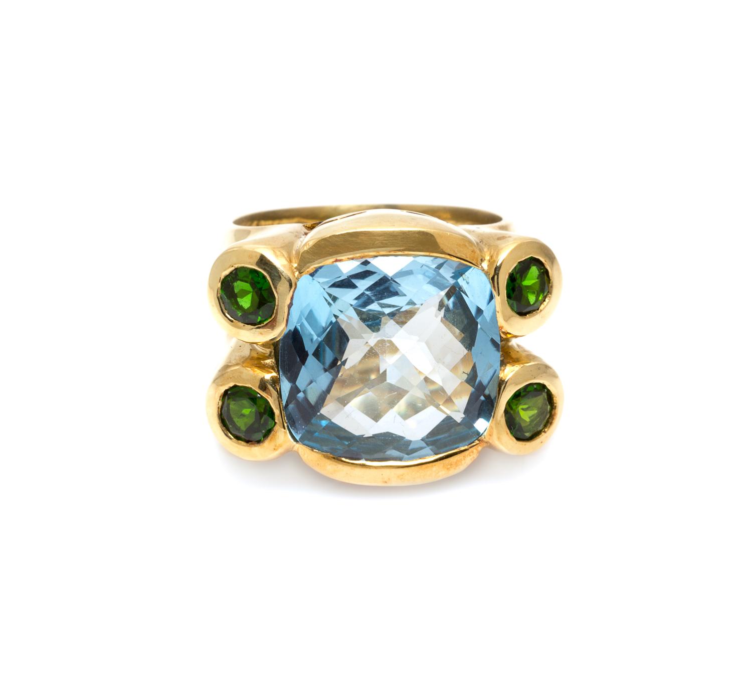 An 18 Karat Yellow Gold, Blue Topaz and Green Tourmaline Ring, 13.00 dwts.